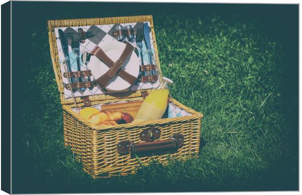 Picnic Basket With Orange Juice Bottle, Apples, Pe Canvas Print by Radu Bercan