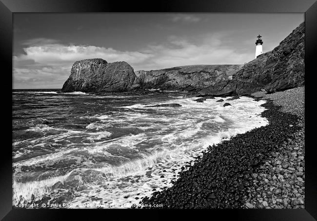 Yaquina Lighthouse on top of rocky beach Framed Print by Jamie Pham
