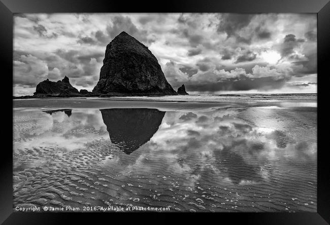 Cannon Beach with storm clouds in Oregon Framed Print by Jamie Pham
