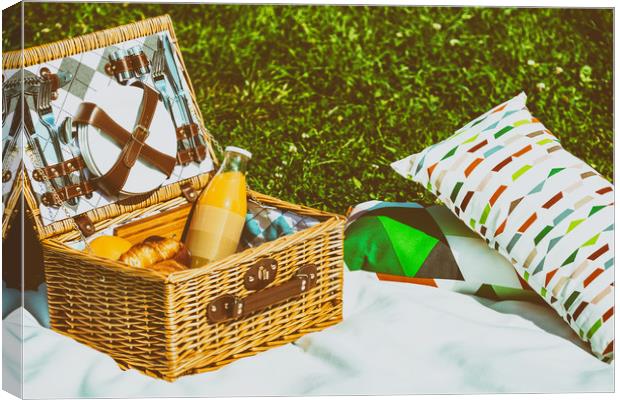 Picnic Basket Food On White Blanket With Pillows I Canvas Print by Radu Bercan