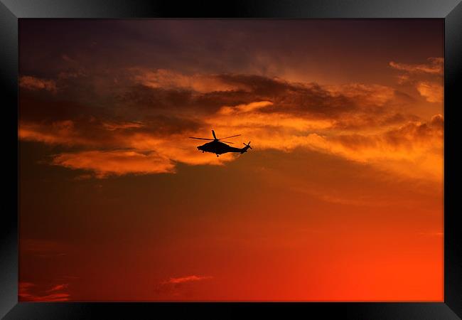 Helicopter At Sunset Framed Print by Ian Jeffrey