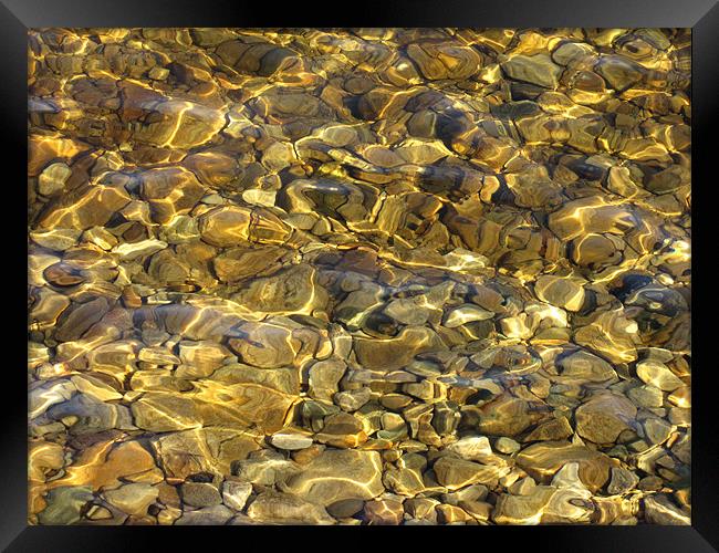 Pebbles in Water Framed Print by Jacqi Elmslie