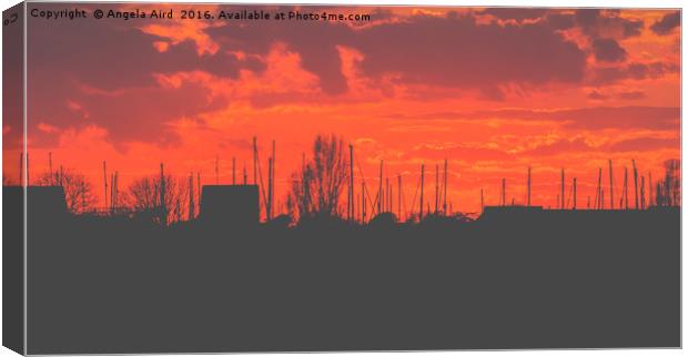 Fiery Sunset Canvas Print by Angela Aird
