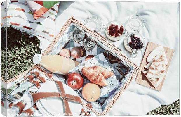 Picnic Basket With Fruits, Orange Juice, Croissant Canvas Print by Radu Bercan