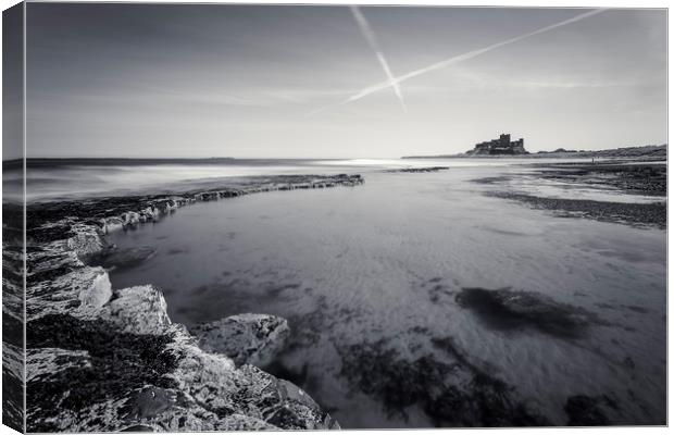 Bamburgh Castle and Contrails Canvas Print by Paul Appleby