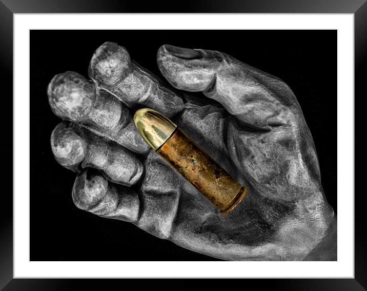 Bullet in hand Framed Mounted Print by Jonathan Thirkell