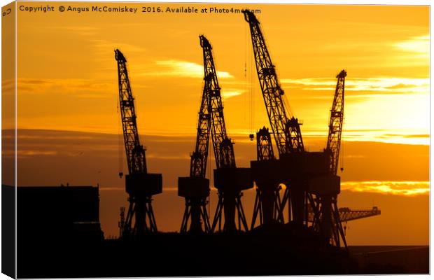 Cranes on the River Clyde at sunset Canvas Print by Angus McComiskey