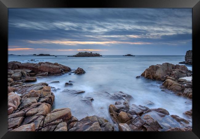 Sunset at cobo bay  Framed Print by chris smith
