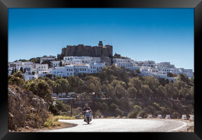 PATMOS, GREECE - SEPTEMBER 25, 2016: A moped drive Framed Print by George Cairns
