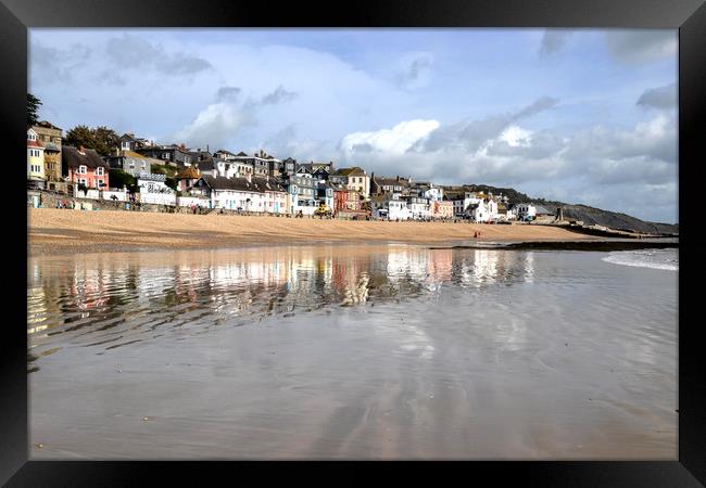 Lyme Regis reflected in the sand and sea Framed Print by Lynn Carter