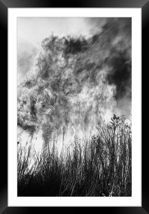 Faces on fire in the sky Framed Mounted Print by Alfredo Bustos