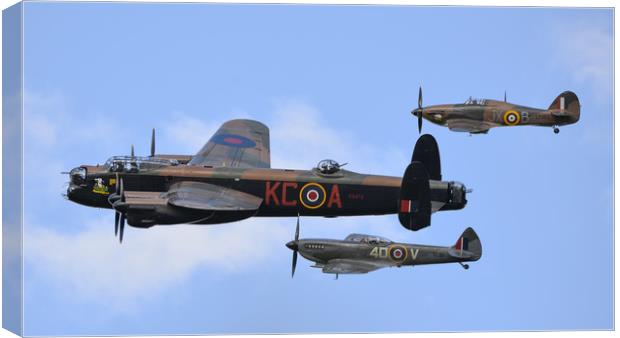 Lancaster PA474 and BBMF's hurricance and spitfire Canvas Print by Andrew Scott