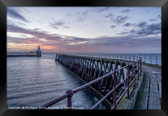 The Blyth piers at sunrise Framed Print by Phil Reay
