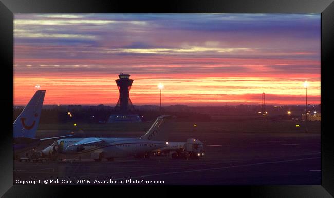 A fiery dawn at Newcastle Airport Framed Print by Rob Cole