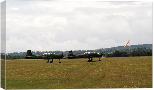 Two Nanchang CJ6 fighter planes near take off Canvas Print by Chris Day