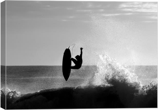 Silhouetted Surfer at Dawn Canvas Print by peter tachauer