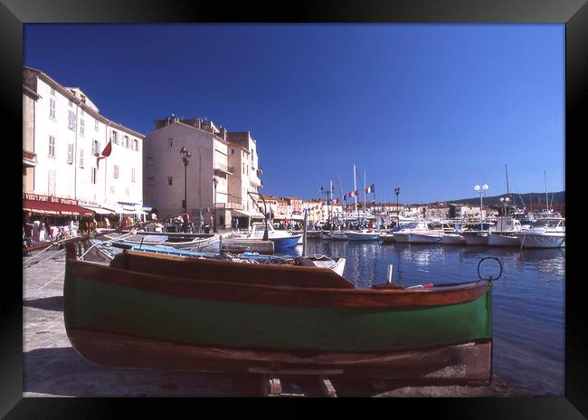 Green boat under dramatic sunny noon in St. Tropez Framed Print by Alfredo Bustos