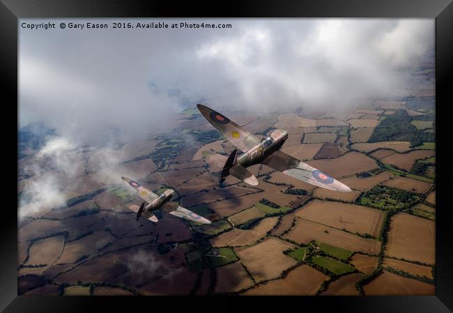 Spitfires among low clouds Framed Print by Gary Eason