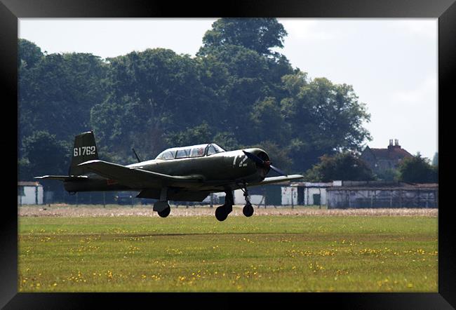 Nanchang CJ6 fighter coming in to land Framed Print by Chris Day