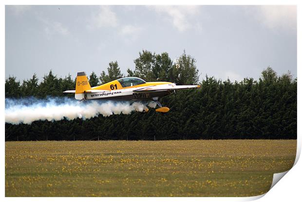 Extra 300 aerobatic plane taking off Print by Chris Day