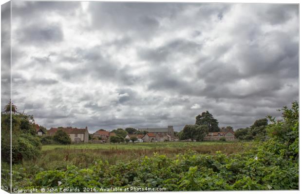 Thornham Norfolk under a leaden sky Canvas Print by John Edwards