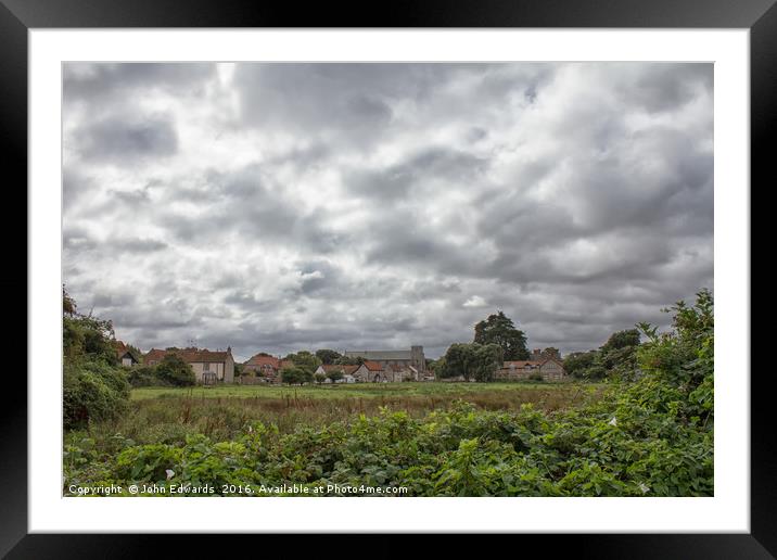 Thornham Norfolk under a leaden sky Framed Mounted Print by John Edwards
