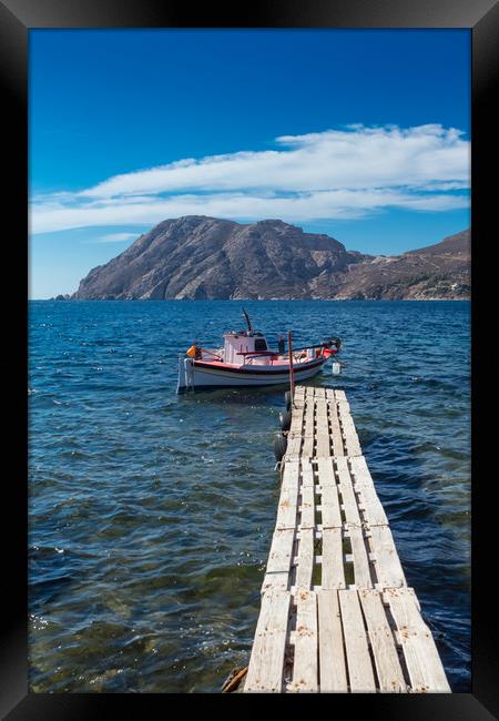 Pier and boat in the Aegean ocean Framed Print by George Cairns