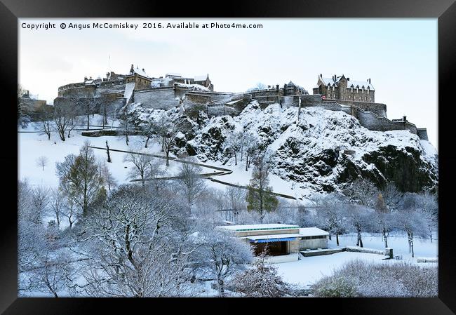 Edinburgh Castle and Ross Bandstand in snow Framed Print by Angus McComiskey