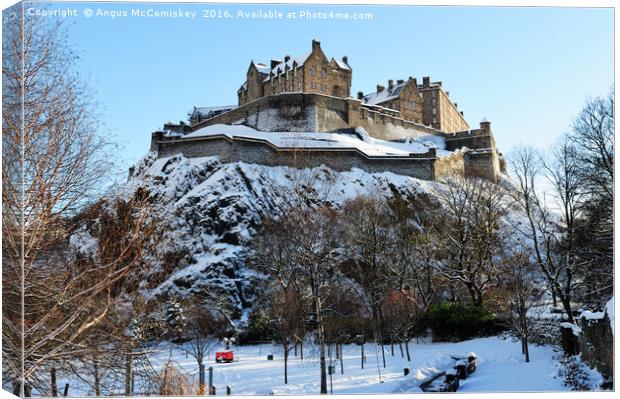 Edinburgh Castle in snow from Princes Street Canvas Print by Angus McComiskey