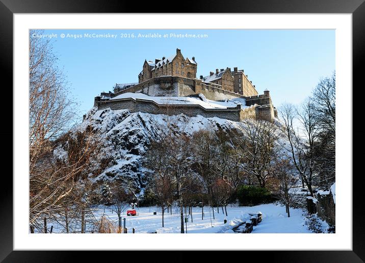Edinburgh Castle in snow from Princes Street Framed Mounted Print by Angus McComiskey