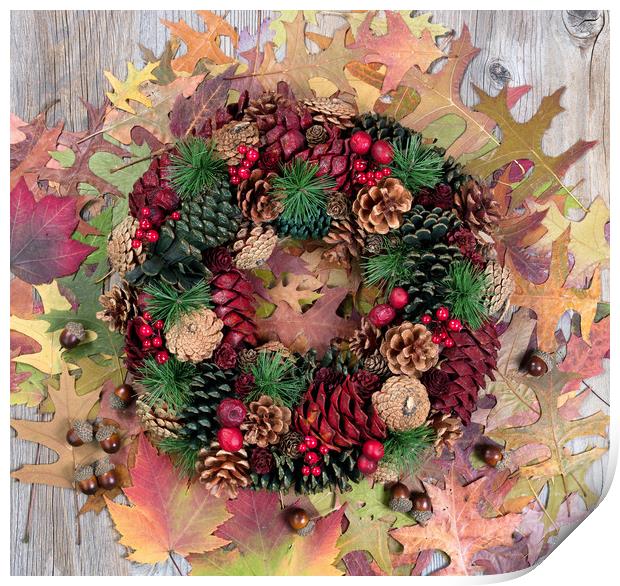 Autumn cone wreath and leaves on rustic wooden boa Print by Thomas Baker