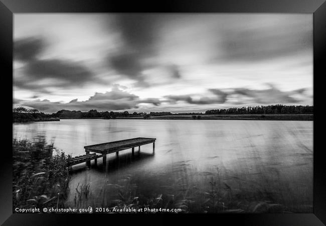 Black and white jetty at lake Framed Print by christopher gould