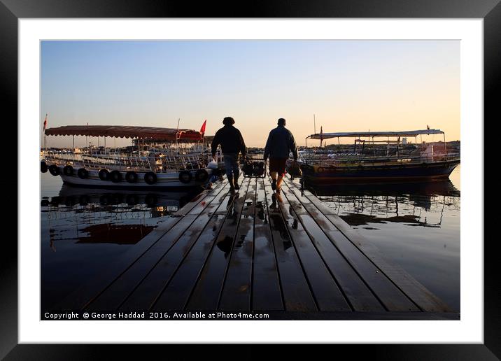 Loading the Boat. Framed Mounted Print by George Haddad