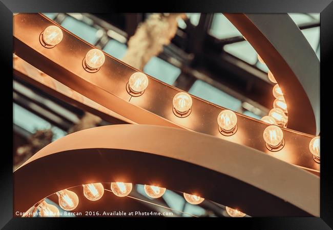 Powered On Light Bulbs On Ceiling Framed Print by Radu Bercan