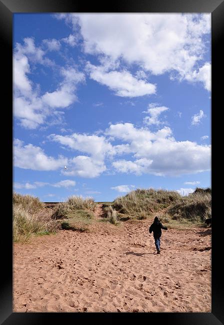 Dawlish Warren Dunes and child Framed Print by K. Appleseed.