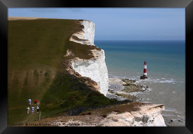Hikers on the South Downs Way near Beachy Head Framed Print by James Brunker