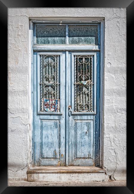 Old Blue Door on Crete Framed Print by Antony McAulay
