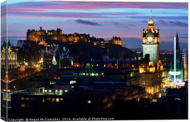 Edinburgh Castle and city skyline at dusk Canvas Print by Angus McComiskey