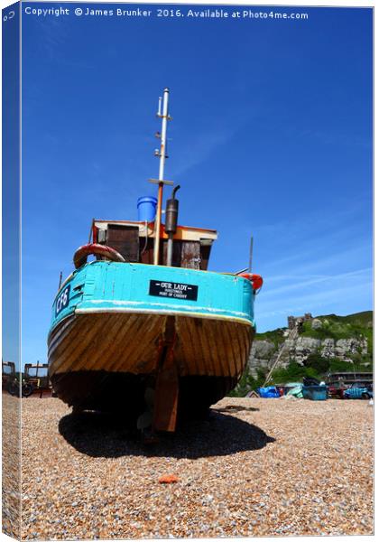 Fishing boat on the beach at Hastings Canvas Print by James Brunker