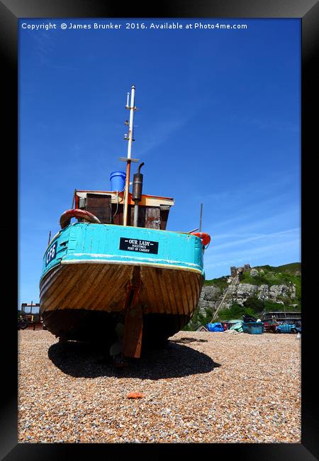 Fishing boat on the beach at Hastings Framed Print by James Brunker