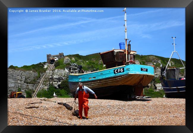 Fisherman at work Hastings East Sussex Framed Print by James Brunker