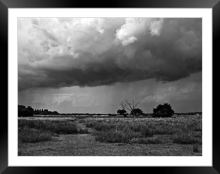 Storm clouds are gathering mono Framed Mounted Print by Paul Macro