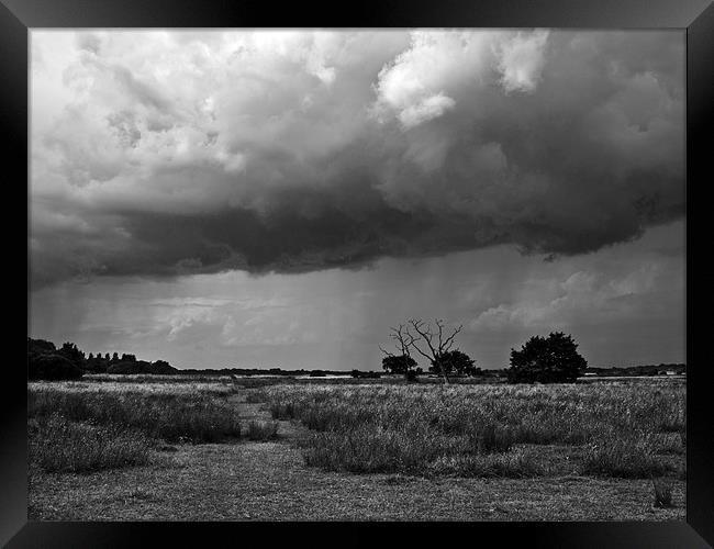 Storm clouds are gathering mono Framed Print by Paul Macro