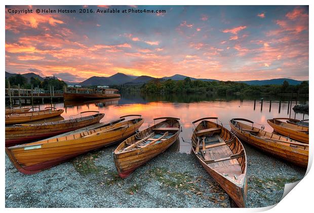 Stunning sunset over wooden rowing boats on Derwen Print by Helen Hotson