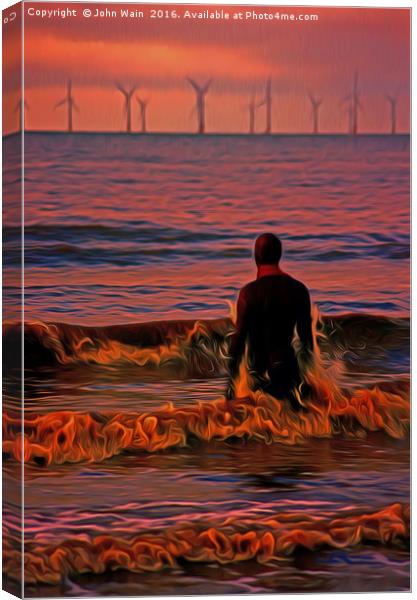 In the surf at Sunset Canvas Print by John Wain