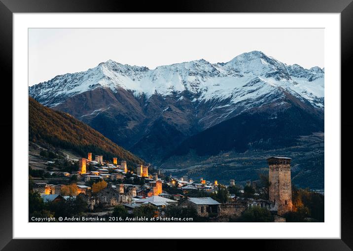 Svan towers with illumination in Mestia at sunrise Framed Mounted Print by Andrei Bortnikau