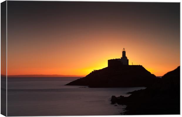 Golden sunrise over Mumbles lighthouse Canvas Print by Leighton Collins