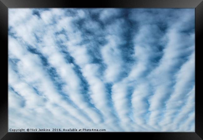 High White Furrow Clouds in a Blue Sky Framed Print by Nick Jenkins