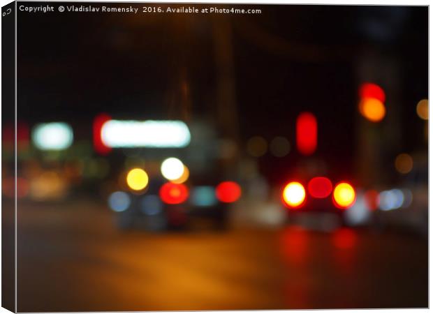 Defocused red and yellow lights on the night the t Canvas Print by Vladislav Romensky