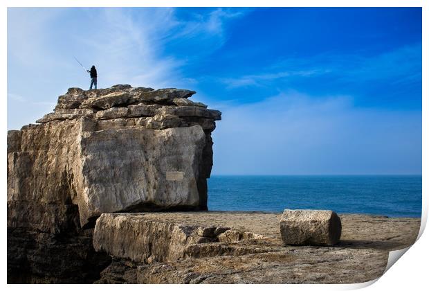 Fisherman casting a rod on the coast cliff rock Print by André Jorge